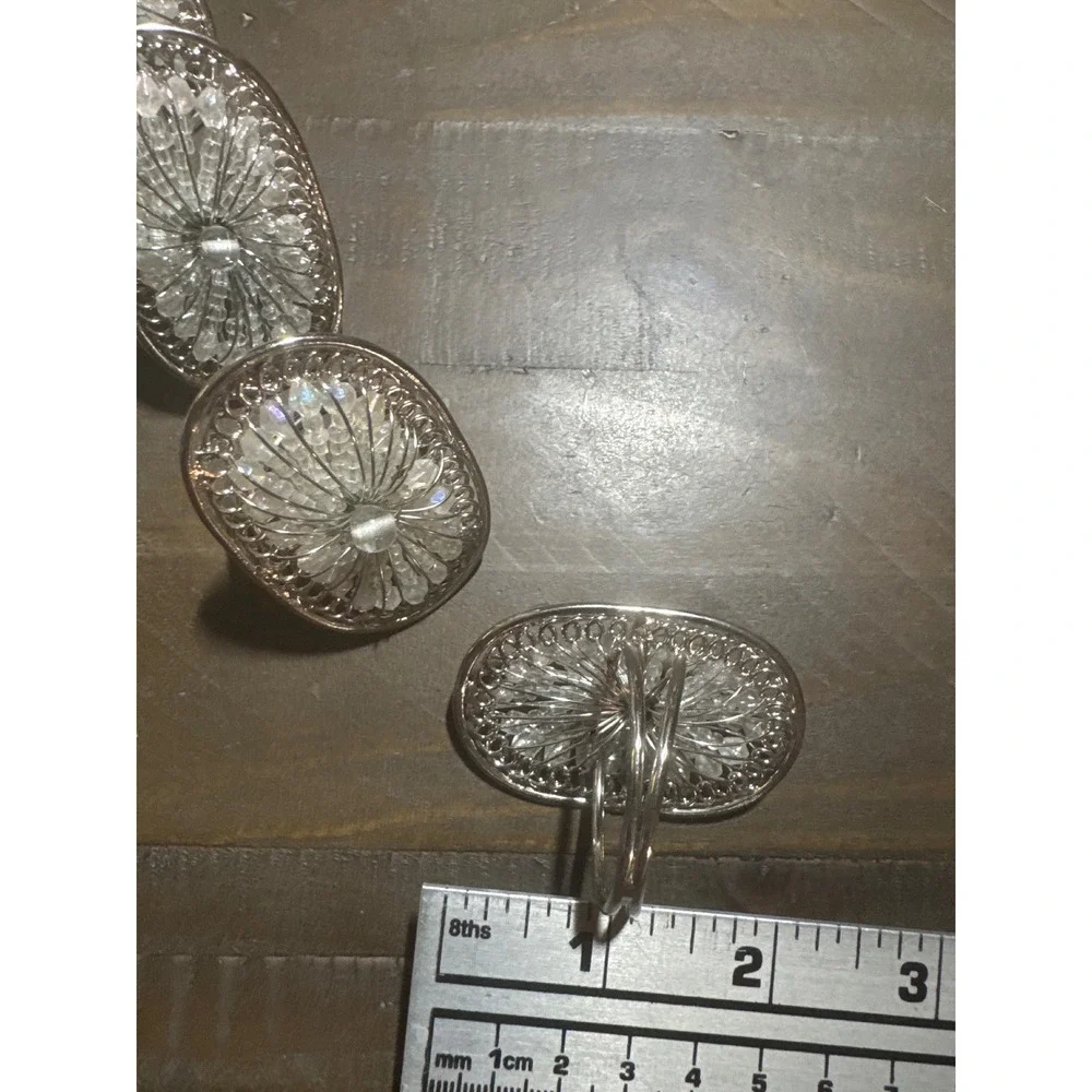 Pier 1 Set of 7 Silver Tone Beaded Filigree Oval Napkin Rings Clear Starburst